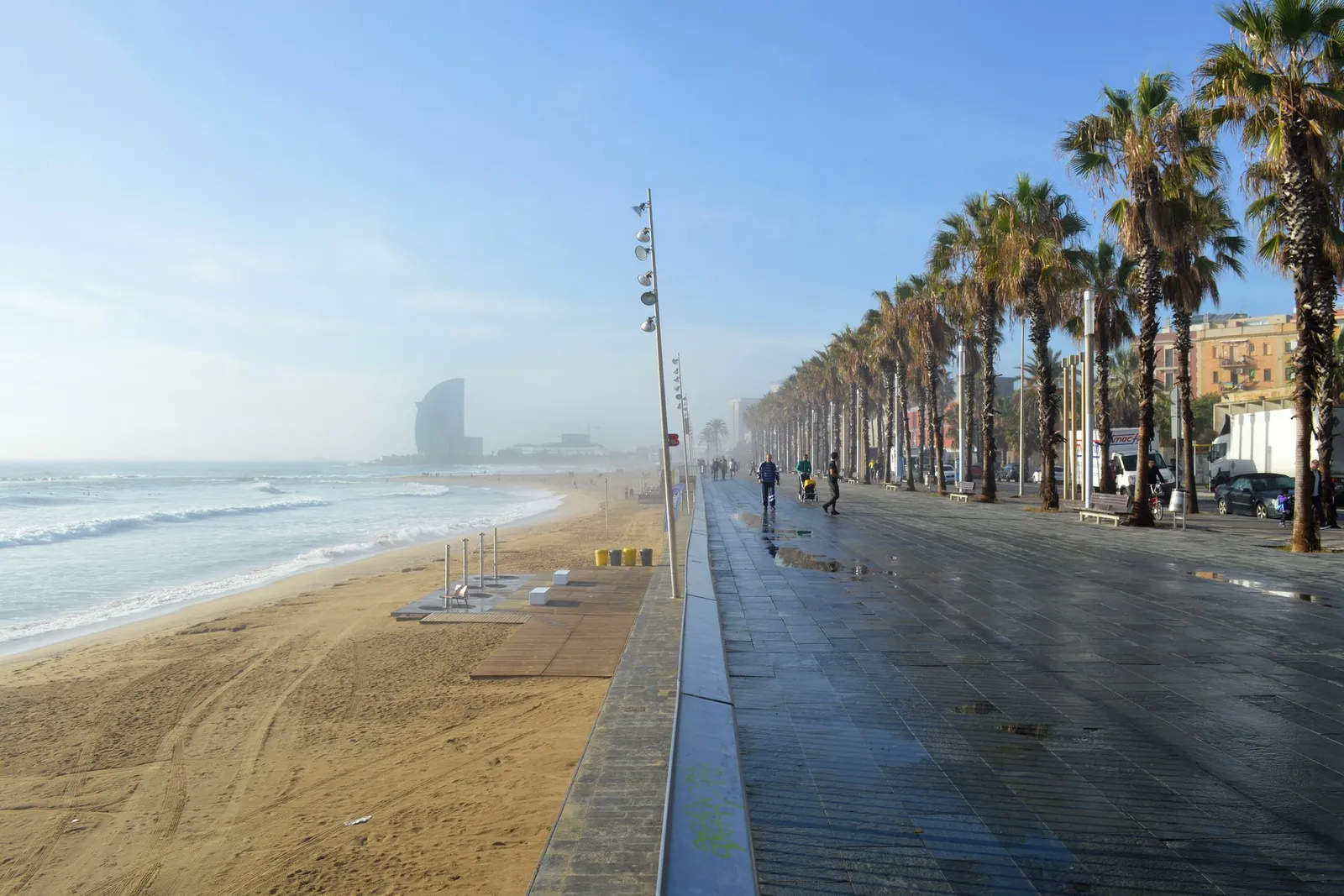 The promenade and Barceloneta beach on a sunny day