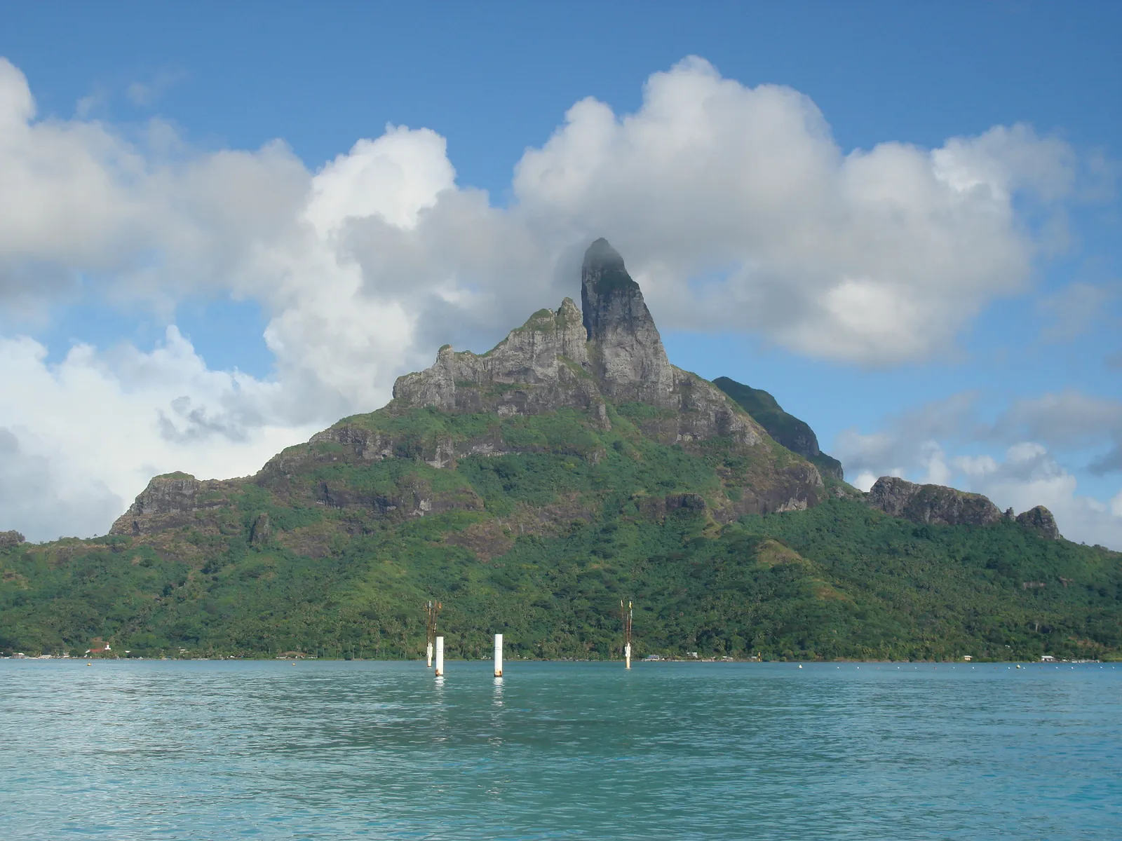 Mount Otemanu above the lagoon, green-clad, under the clouds