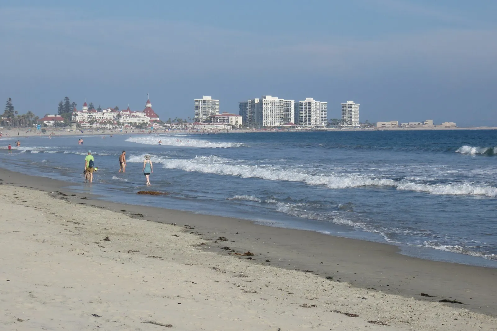 Coronado Beach with the surf and the San Diego skyline on the horizon