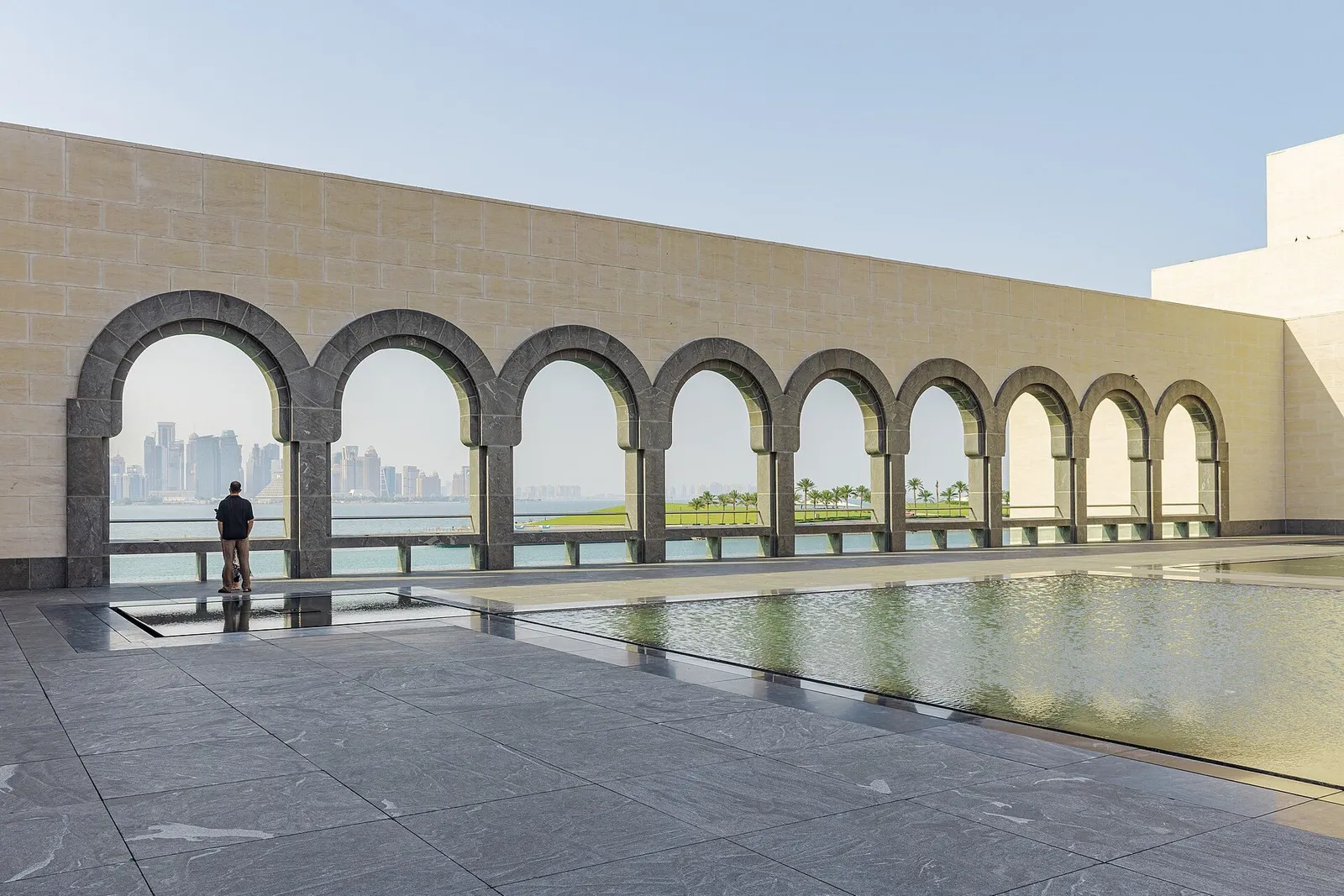 The Museum of Islamic Art’s arcade looking across the bay to West Bay’s towers