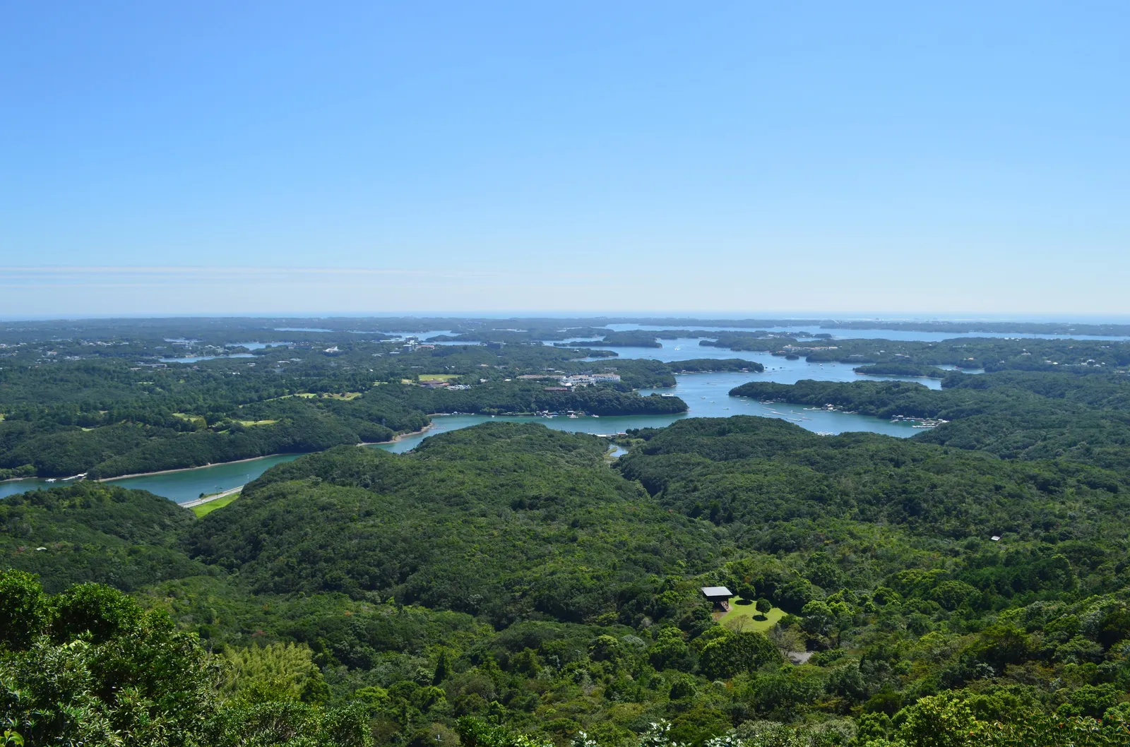 Ago Bay from the Yokoyama lookout: wooded islands and inlets under a clear sky