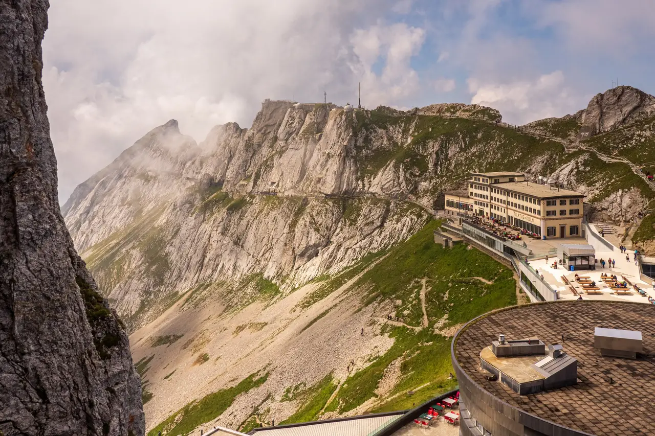 Pilatus Kulm: the summit hotel and station on the ridge, with rock faces and grassy slopes below