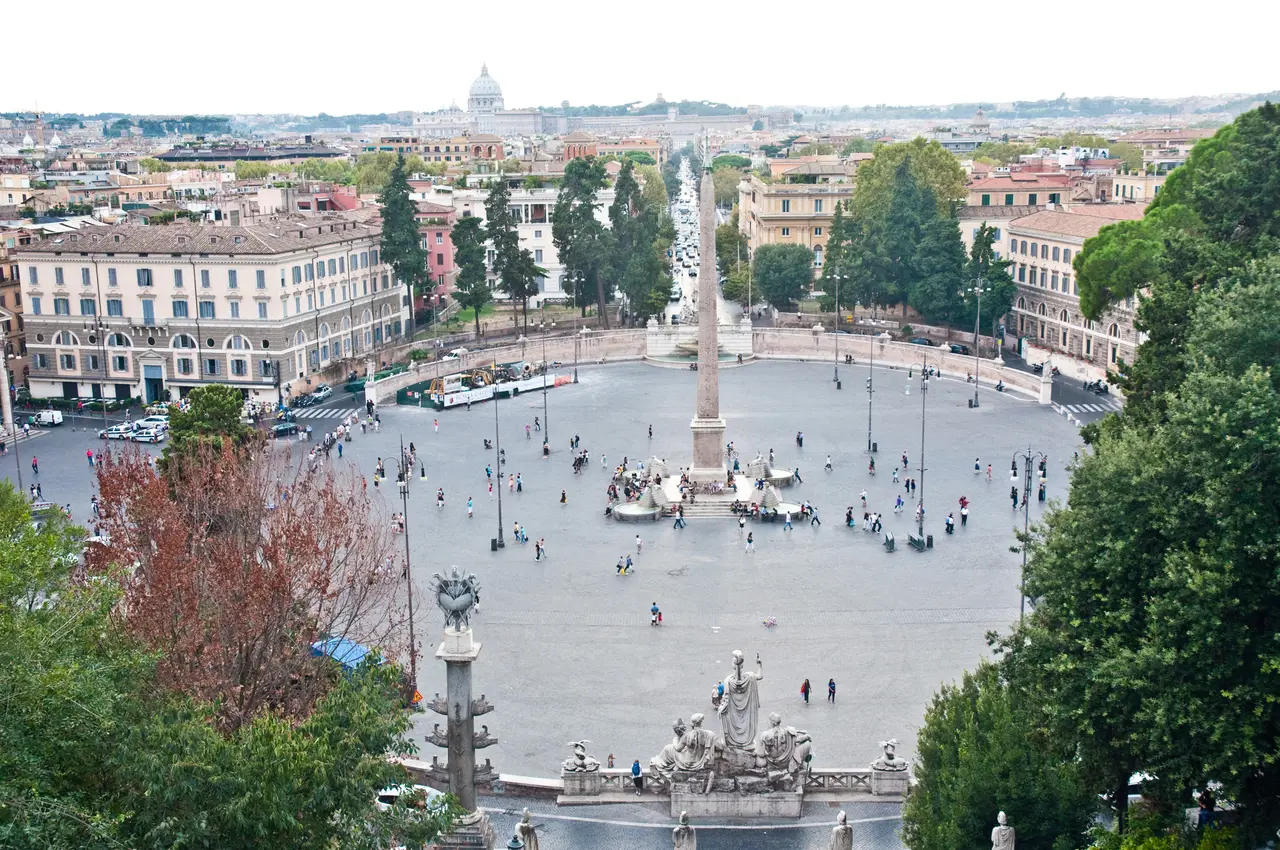Piazza del Popolo from the Pincio terrace: the obelisk at the centre of the square, the palazzi around it and St Peter’s dome on the skyline; below, a rostral column and the statues of the Dea Roma fountain