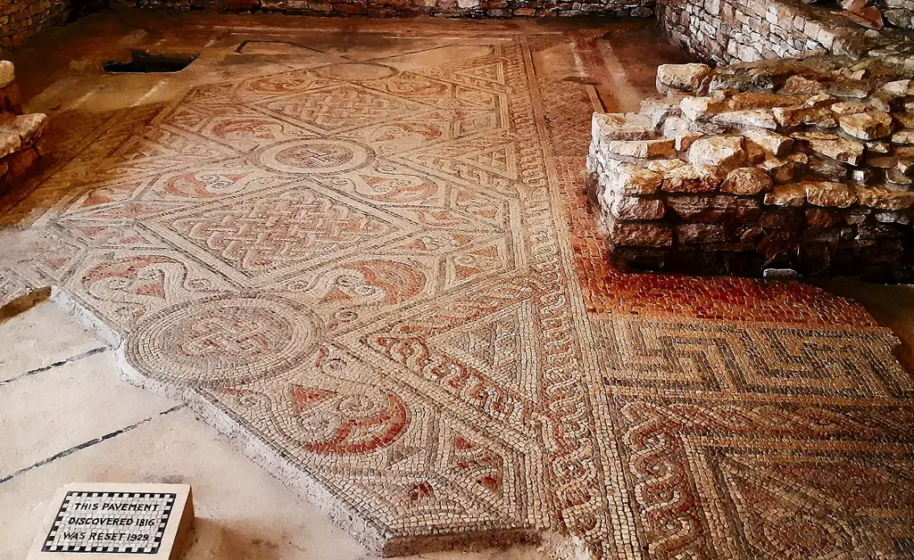 The mosaic floor of North Leigh Roman Villa, patterned in reds and browns