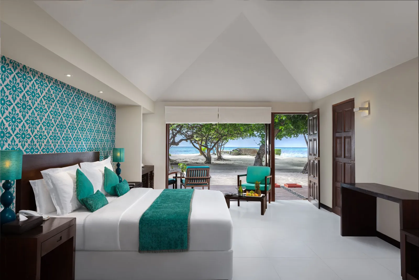 A Family Beach Villa bedroom, open to the garden and the beach
