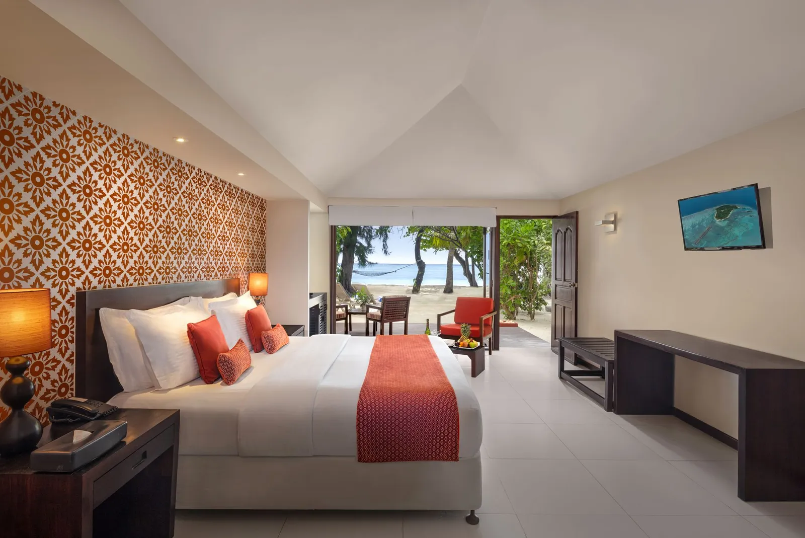 A Sunset Beach Villa, its orange patterned wall and the bed