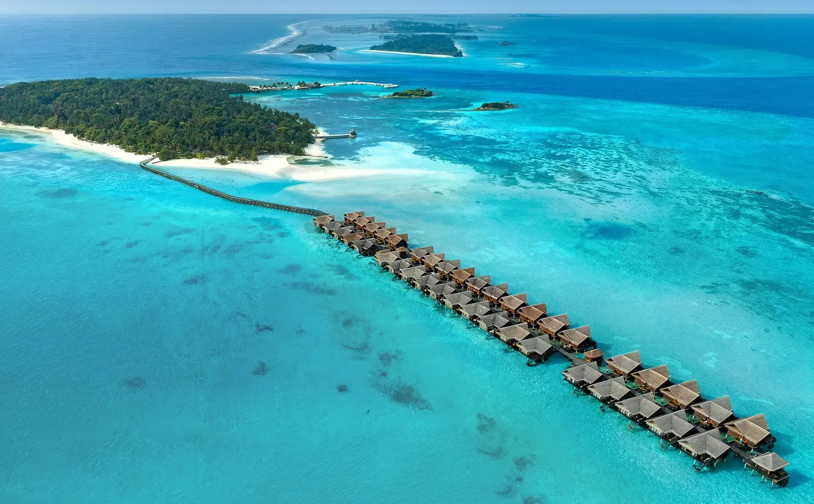 The water-villa jetty from the air, the lagoon and the island