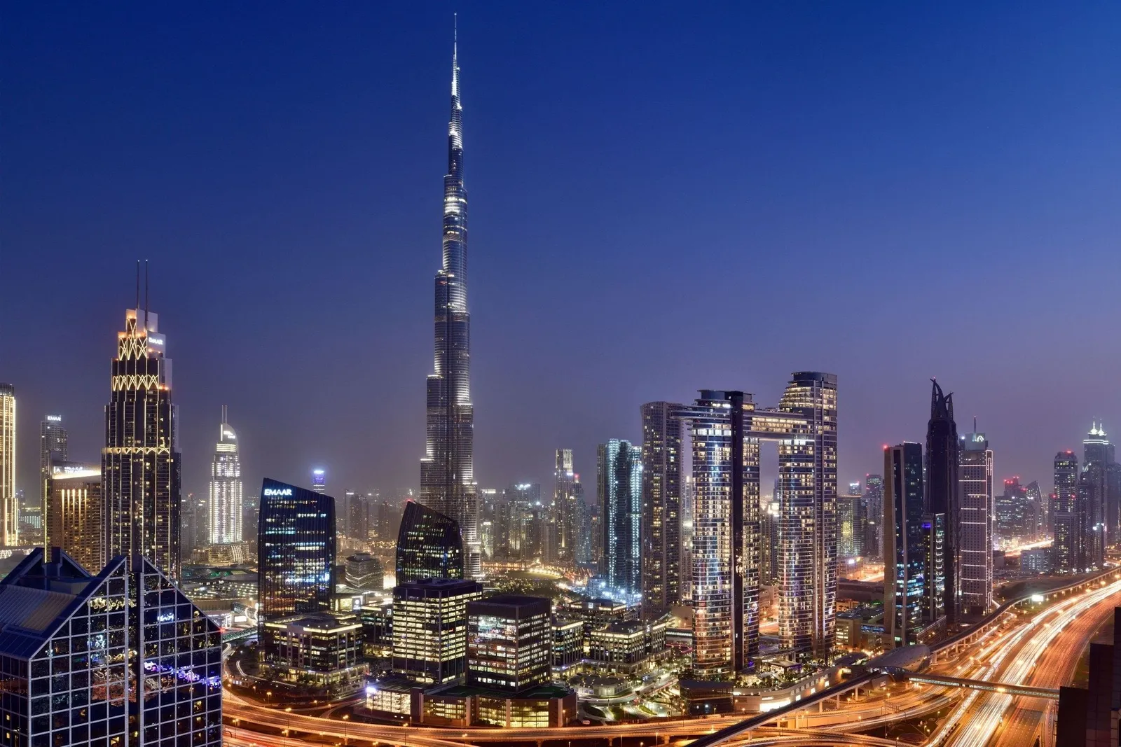 The Burj Khalifa and Downtown lit up at night, seen from above