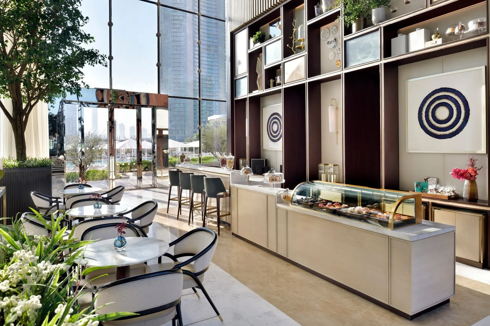 The Patisserie counter between bookshelves and glass