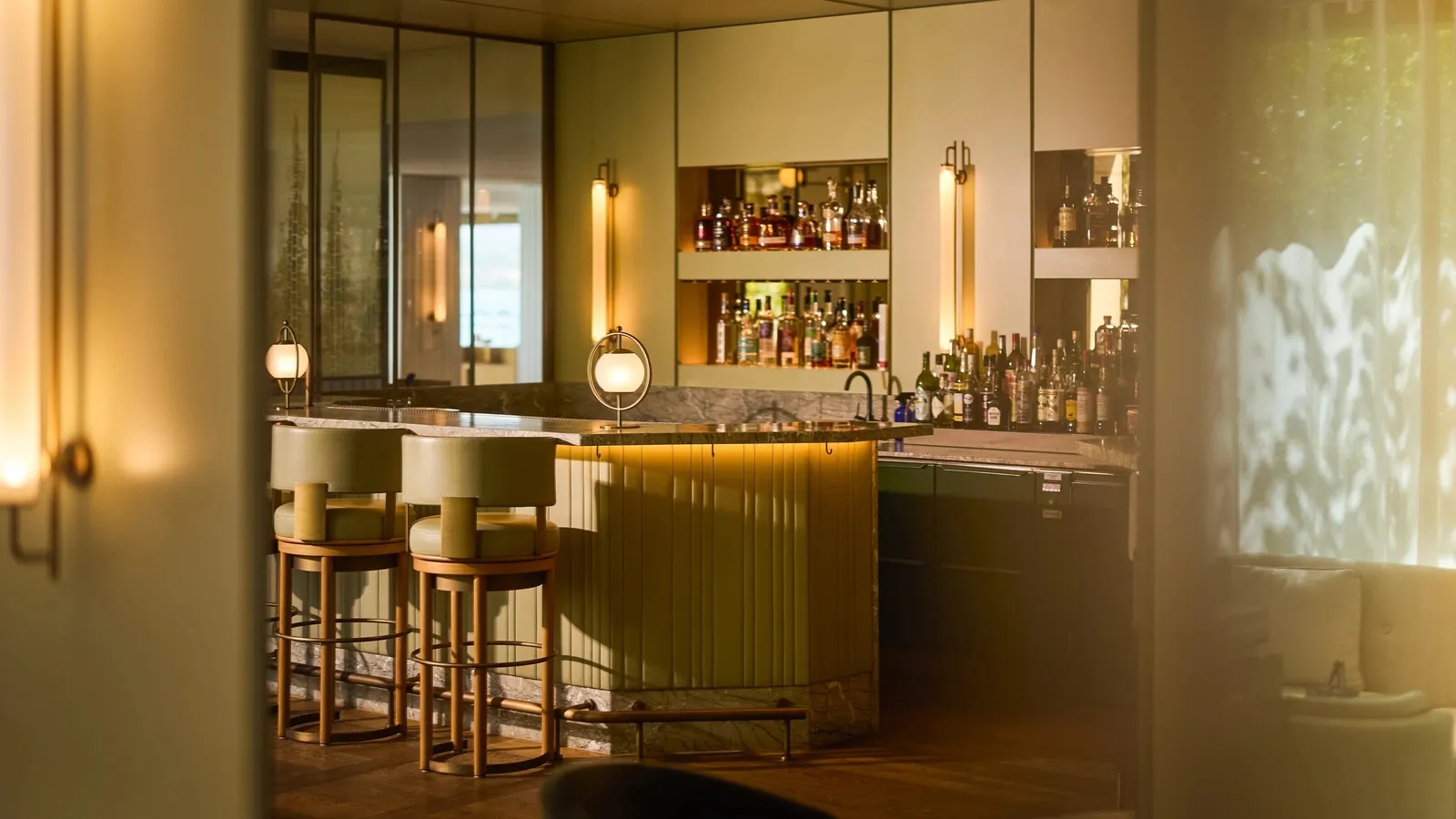 The gold bar and green stools