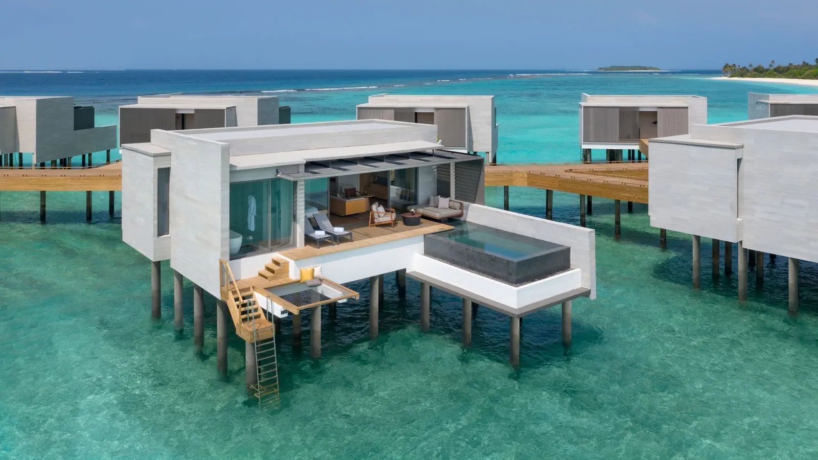An overwater villa with a pool, timber stairs and a terrace net.