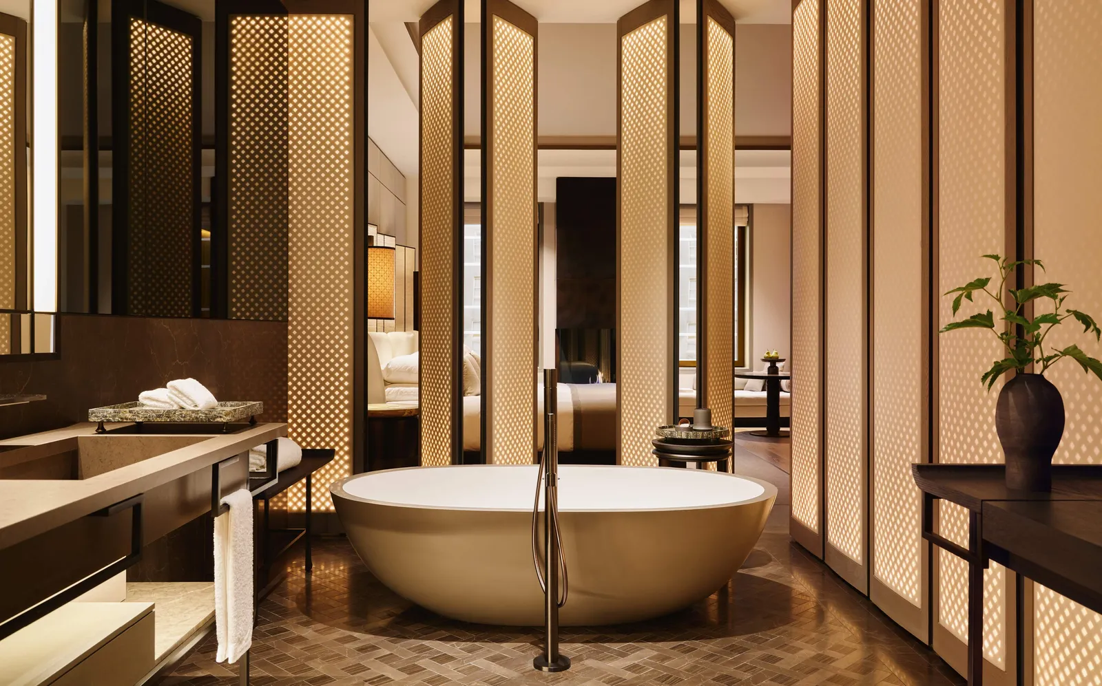 Fifth Avenue Junior Suite bathroom at Aman New York with dual vanity and soaking tub.