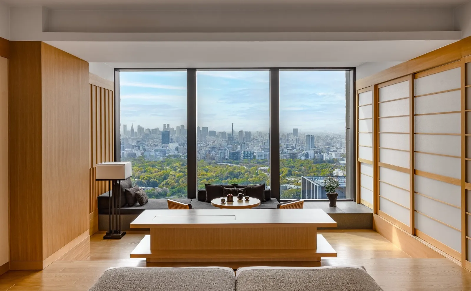 The sunken lounge of a Garden View Suite, its low table before the window onto the Imperial Palace gardens.