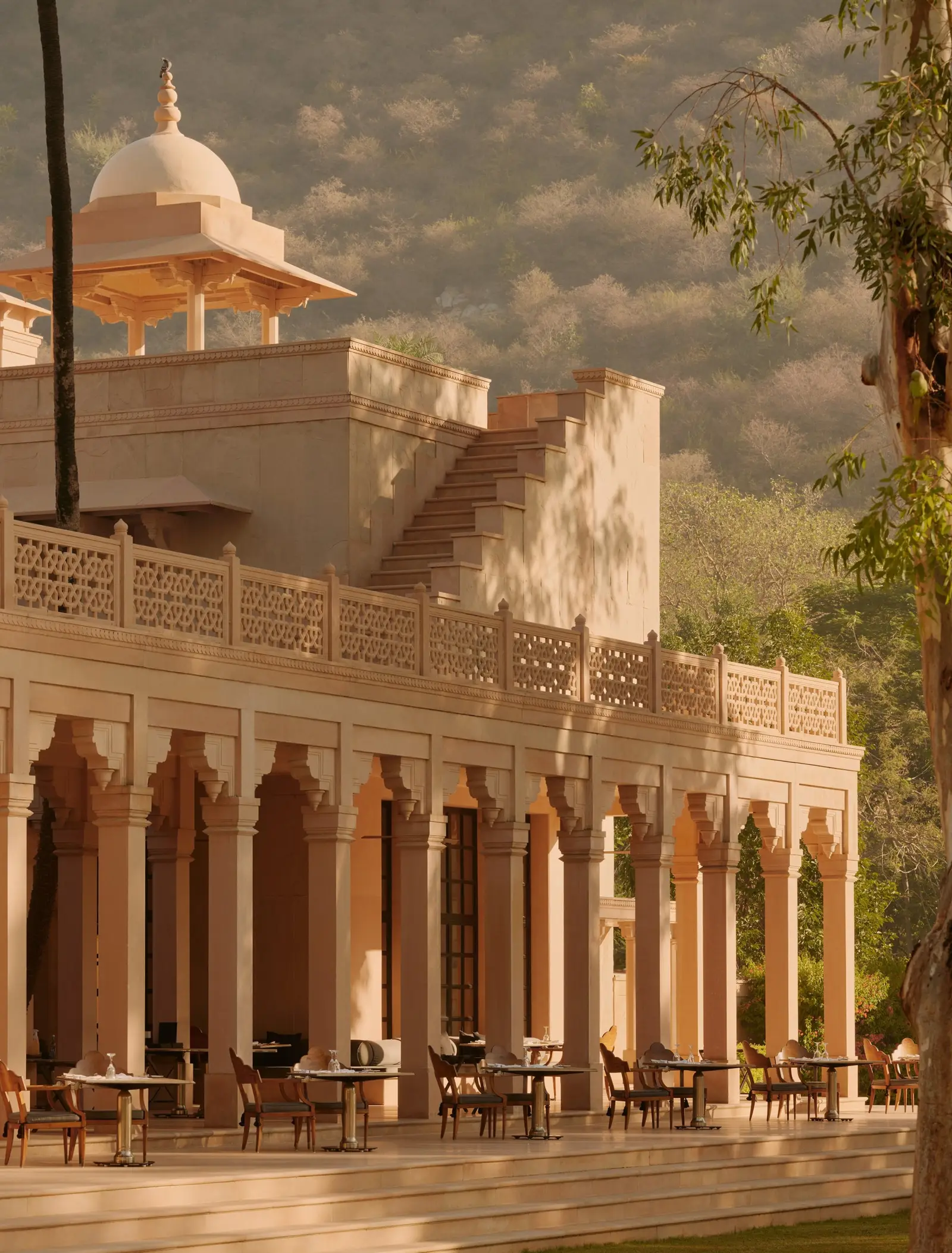 The main building with its colonnade and dome, in afternoon light