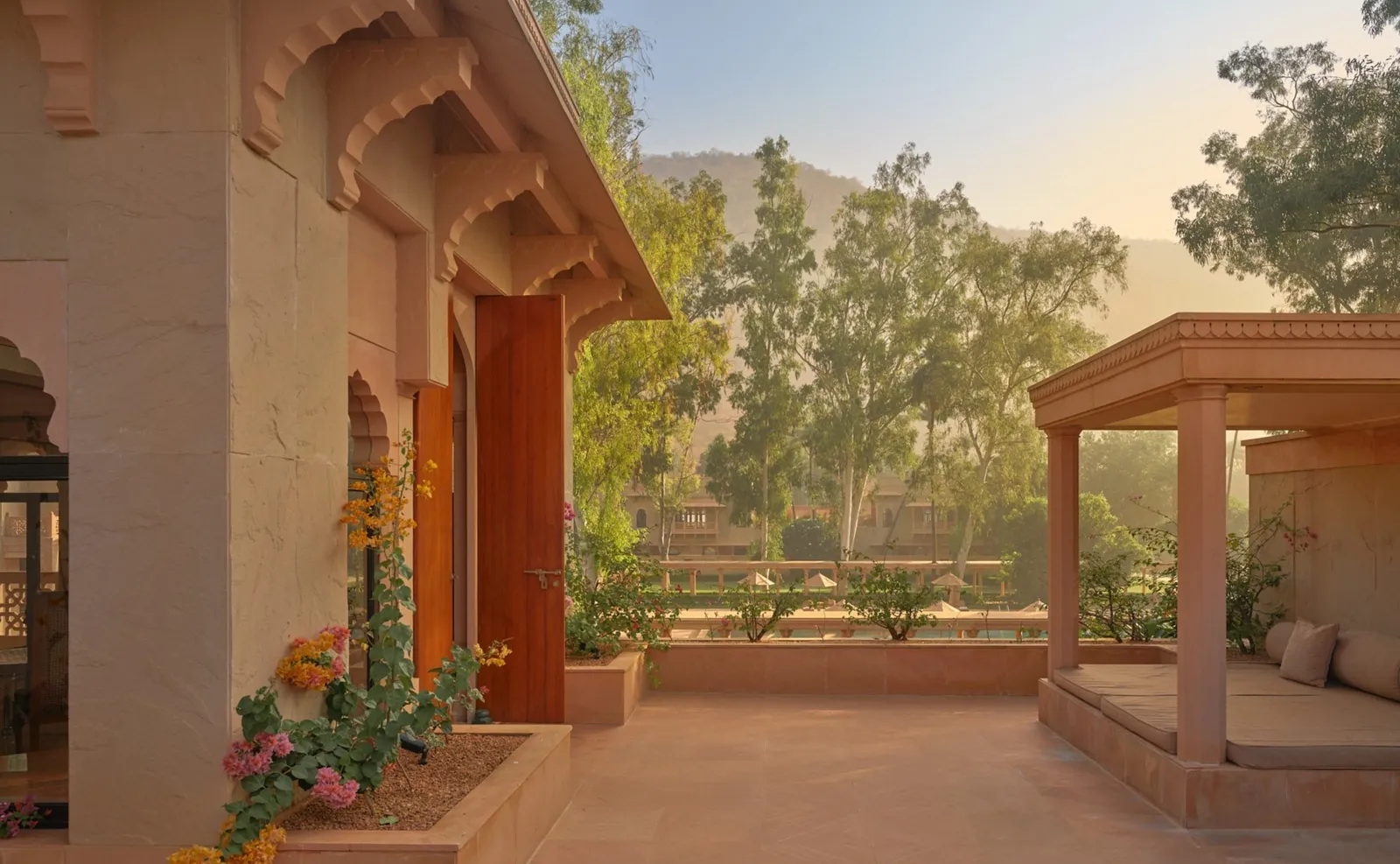 A Terrace Haveli Suite’s terrace at dawn, with its pavilion and the garden’s trees