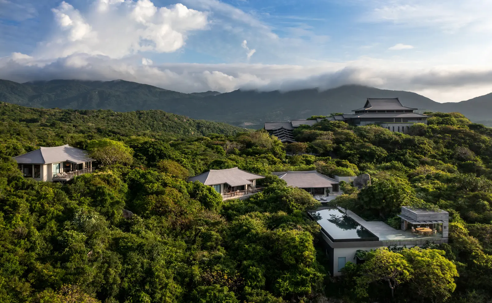The Four-Bedroom Ocean Pool Family Residence from the air: its pavilions in the forest and the Central Pavilion on the hill