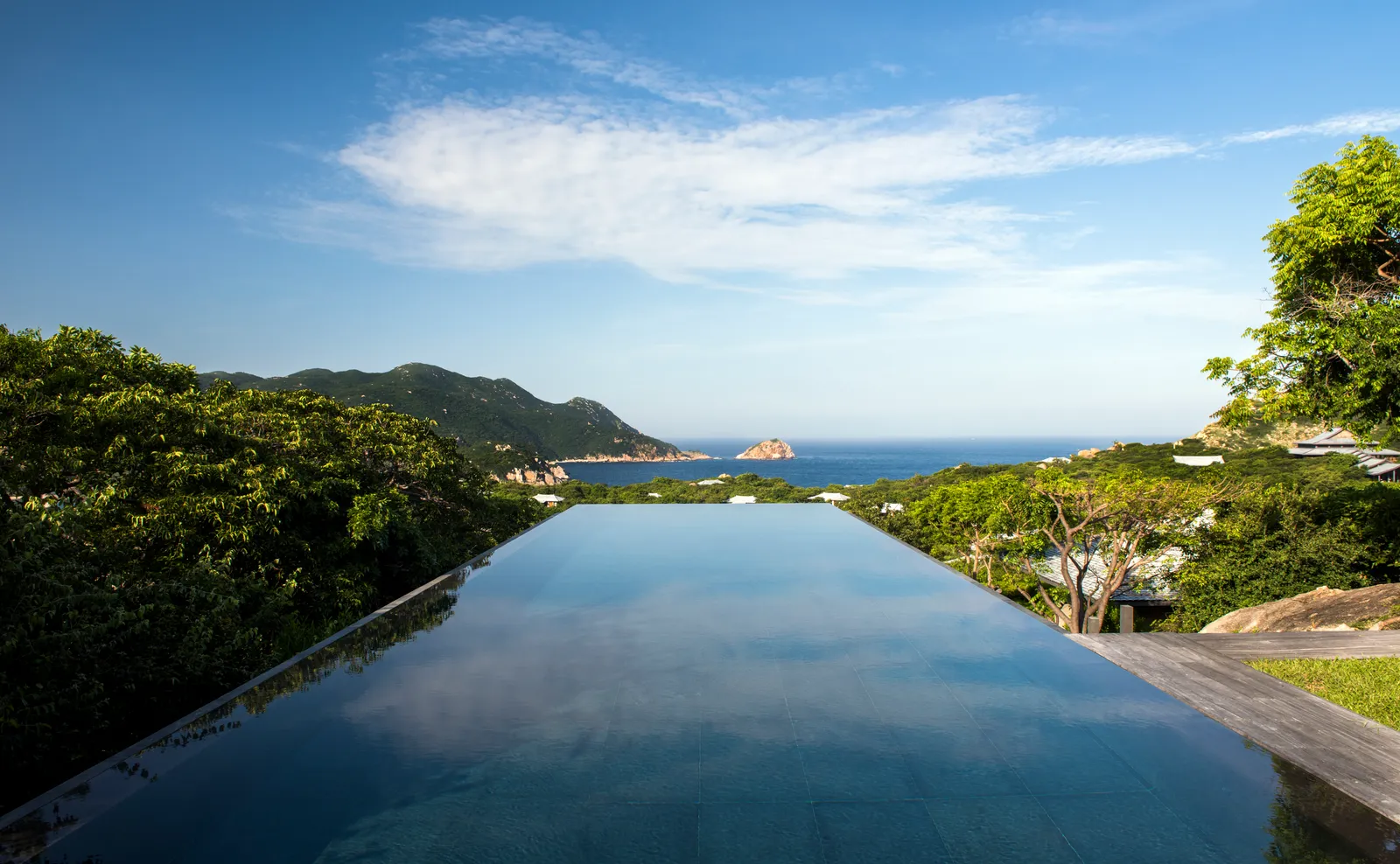 The Four-Bedroom Pool Residence’s infinity pool, with the bay at the end