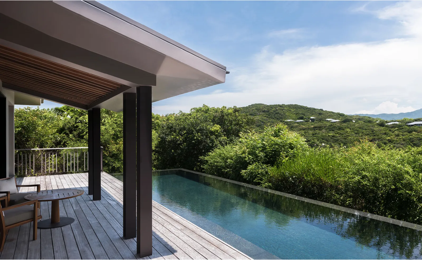 A Mountain Pool Villa deck with its private pool and the green hills