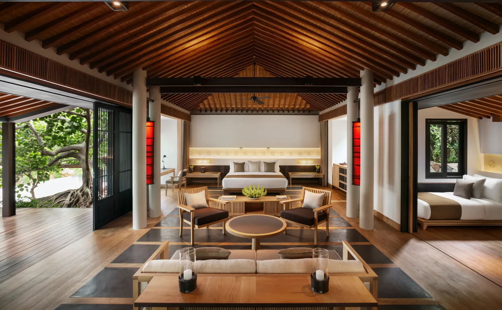The Ocean Pool Family Villa’s living room under the timber ceiling, with the 2 bedrooms either side