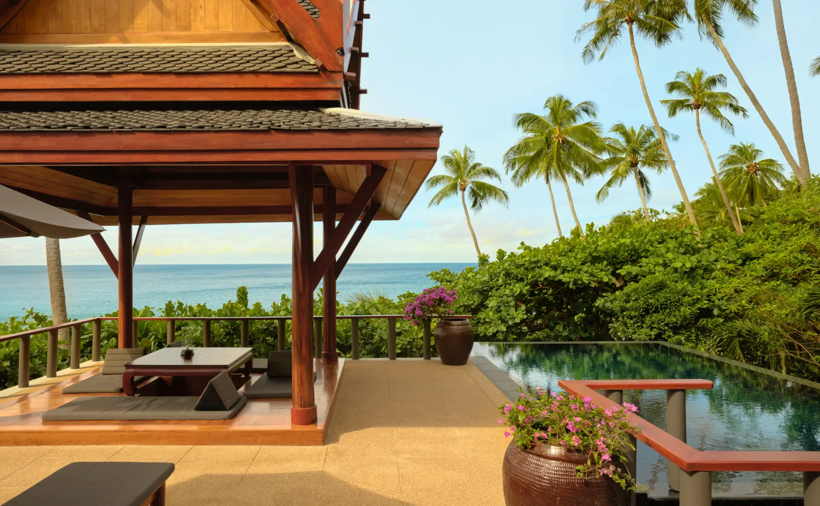 A Deluxe Ocean Pool Pavilion’s sala and pool, the sea beyond the trees