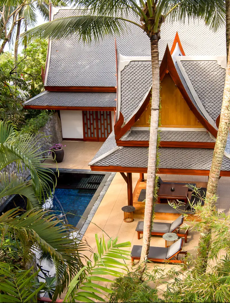 A Garden Pool Pavilion from above: tiled roofs, a narrow pool and a terrace among palms