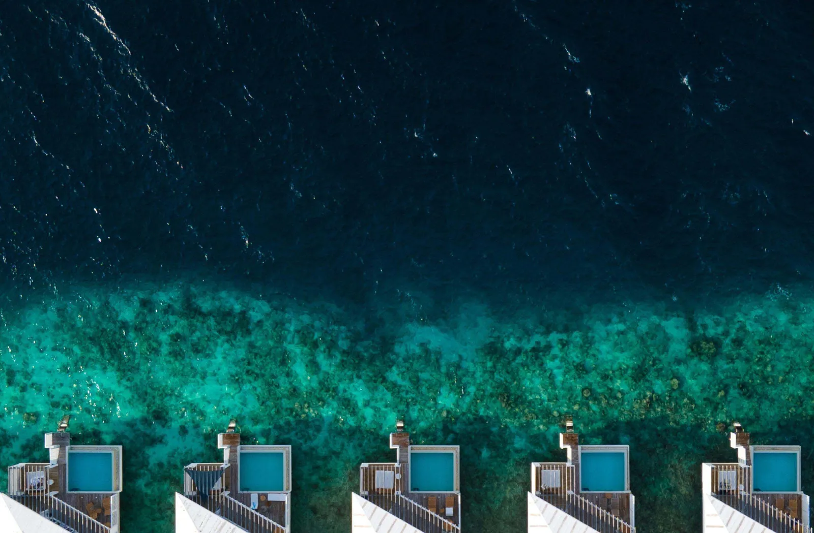 Overwater-villa roofs and deeper water