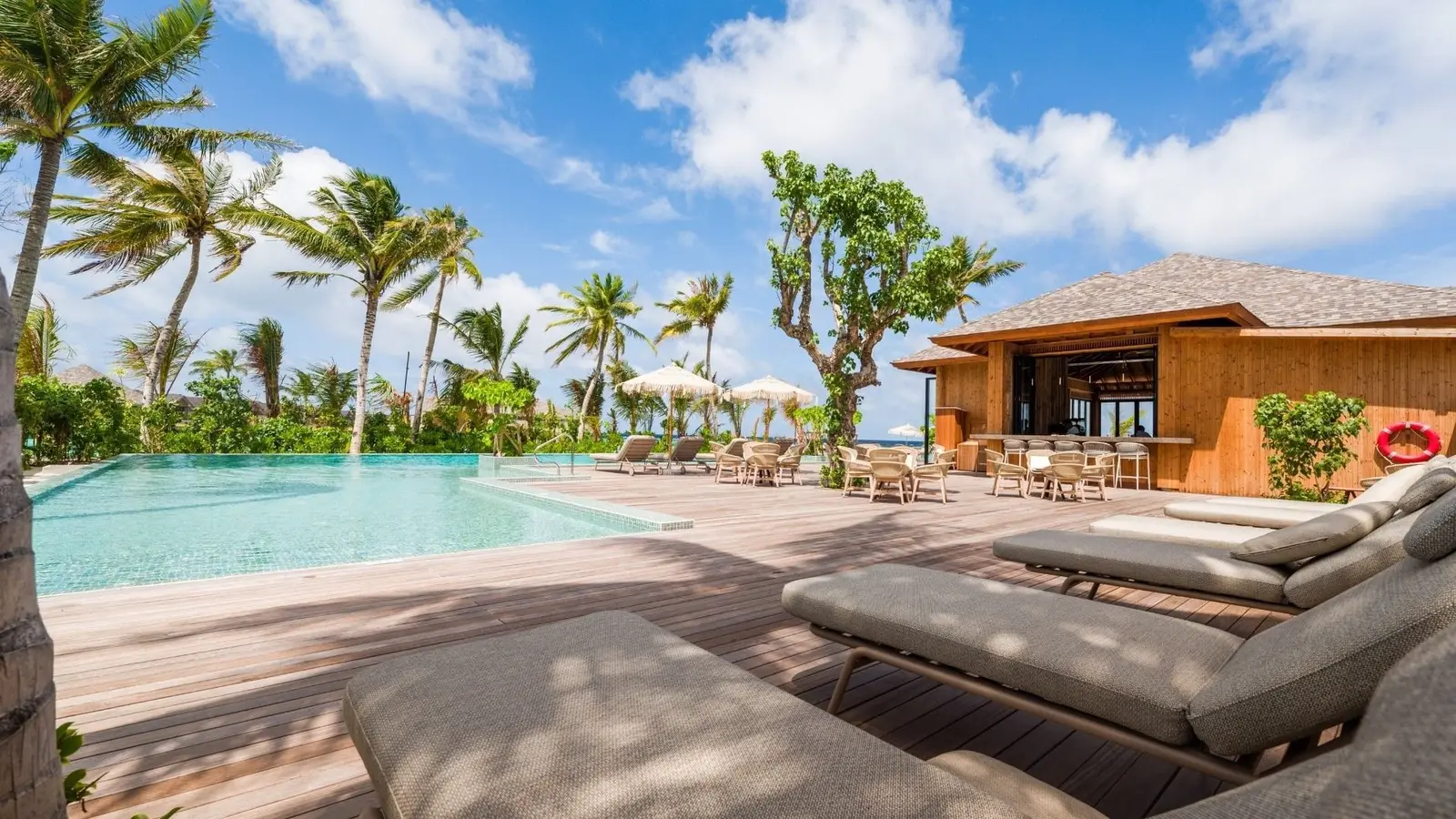 The infinity pool and loungers of the Paradise Beach Club on North Island.