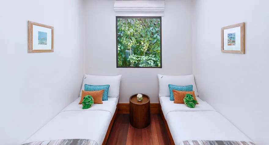 The children’s room in a One Bedroom Family Beach Pool Villa, 2 single beds