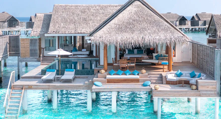 A Sunset Over Water Pool Villa: the pool on its deck and steps into the lagoon
