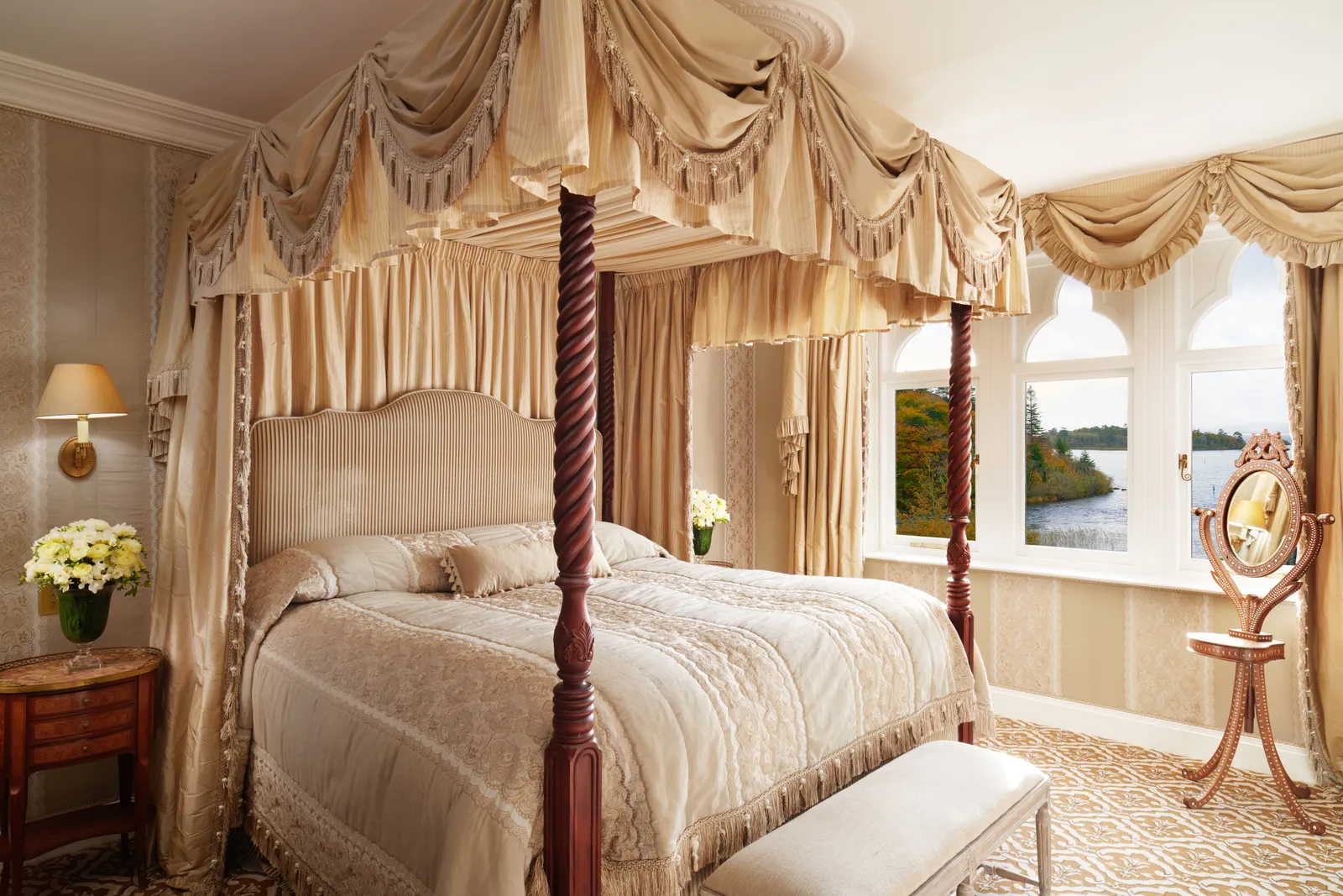 A Junior Stateroom: a four-poster and arched windows over the lake