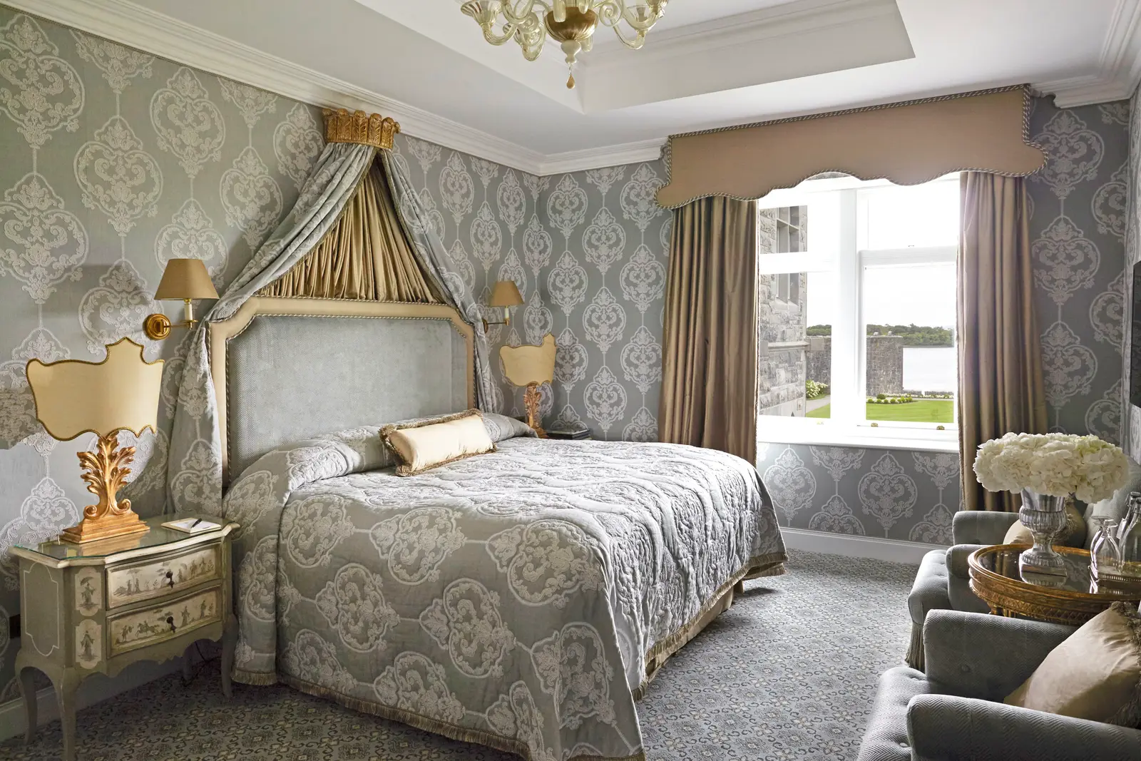 A Lake View Deluxe Room: a crowned headboard and the window over Lough Corrib