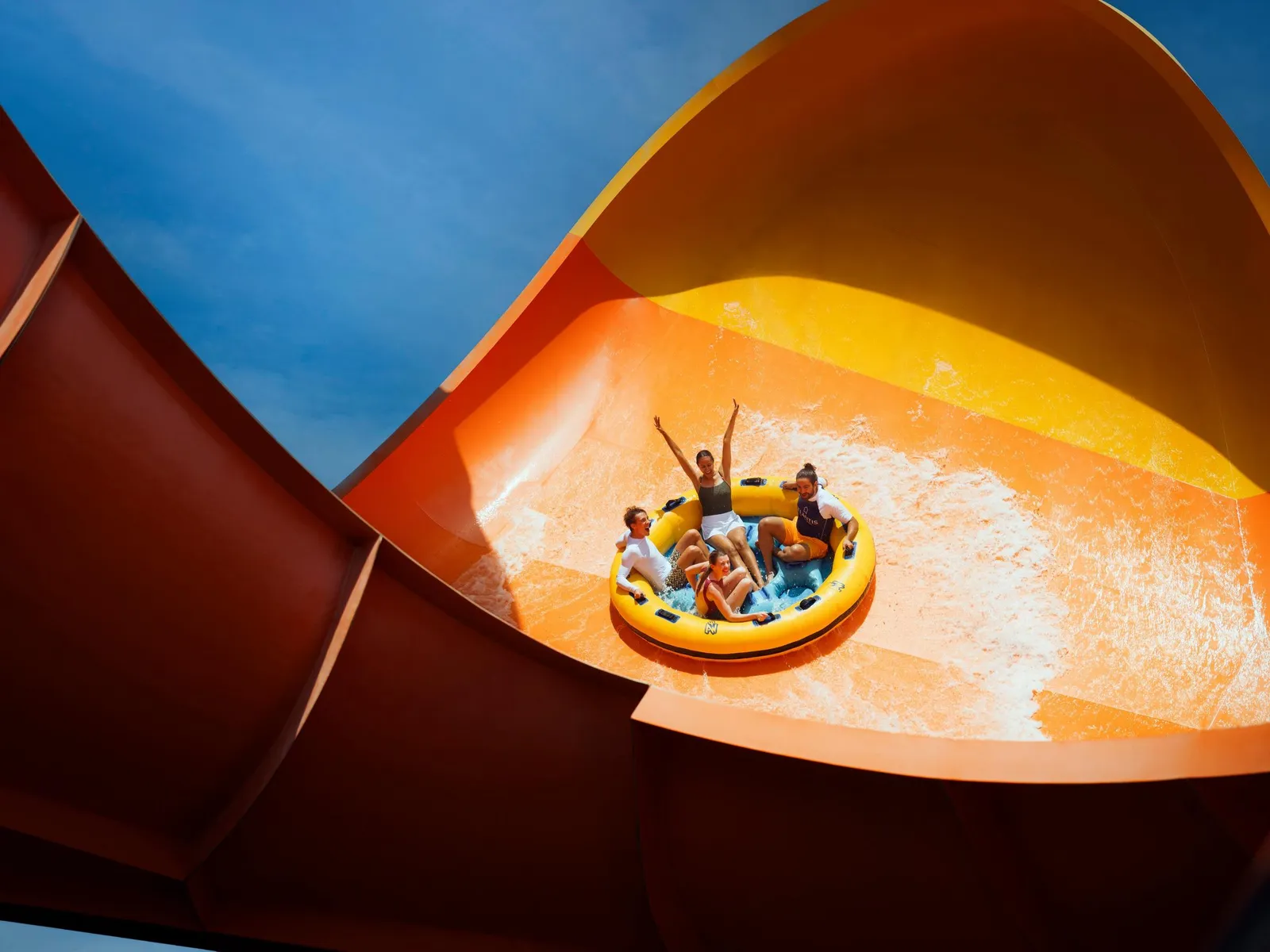 A family on a tube in an Aquaventure slide