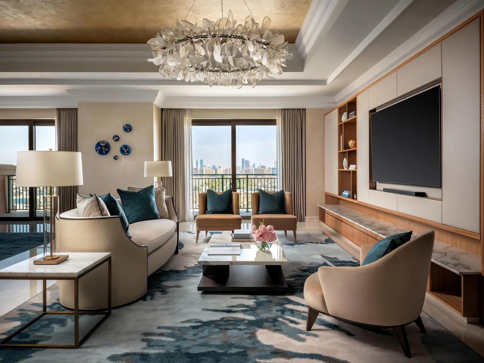 The Presidential Suite living room under a glass chandelier