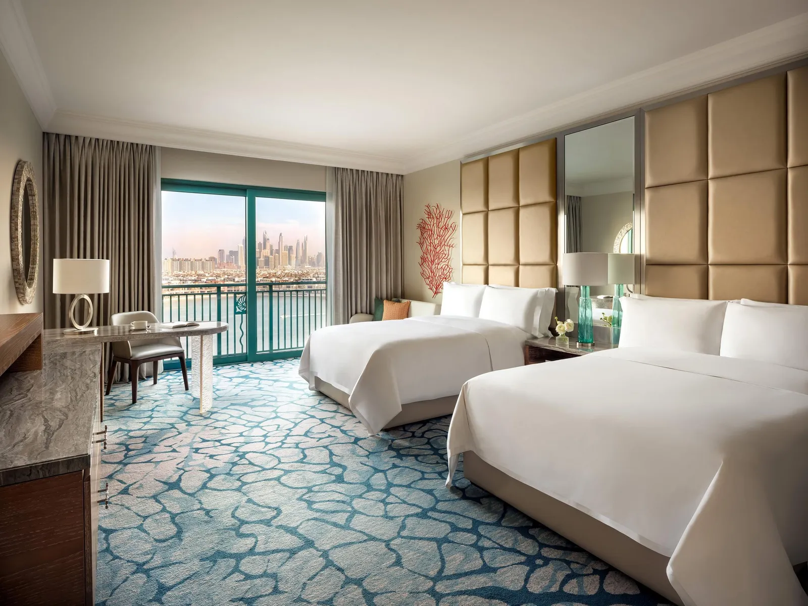 A room with 2 queen beds and a carpet in marine patterns