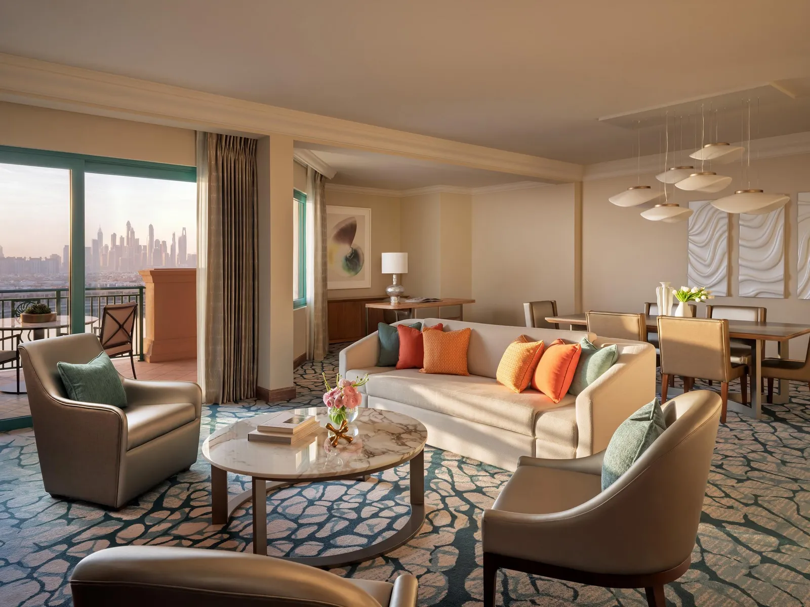 A Regal Suite sitting room with sofas and pale curtains