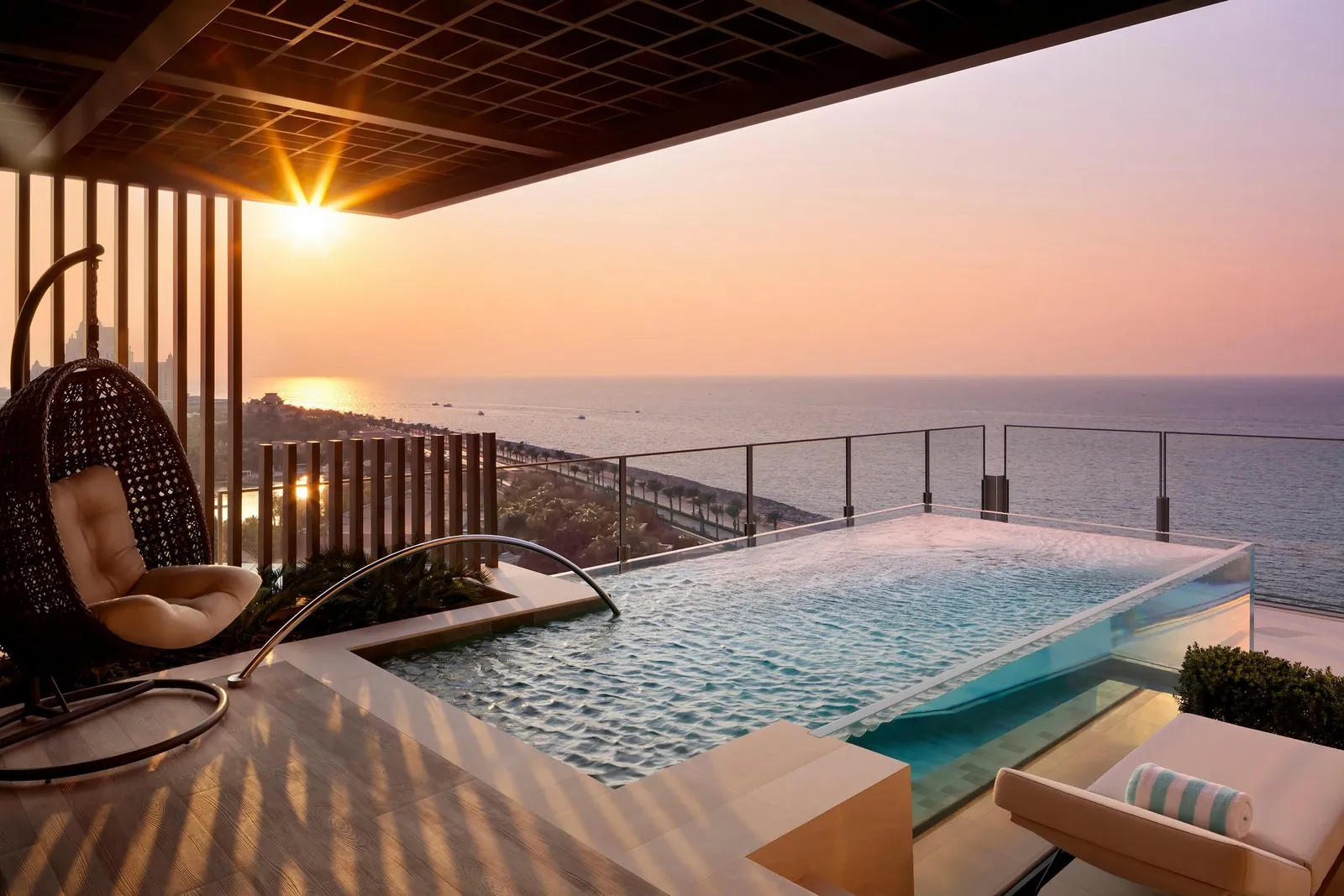 A Sky Pool Villa’s private pool at sunset, over the sea