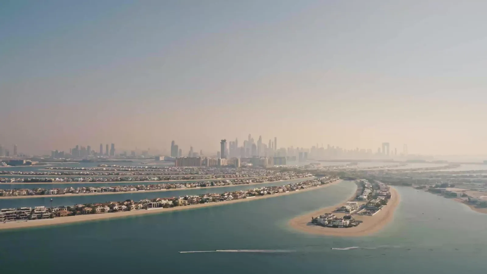 Palm Jumeirah from above, the Dubai skyline behind