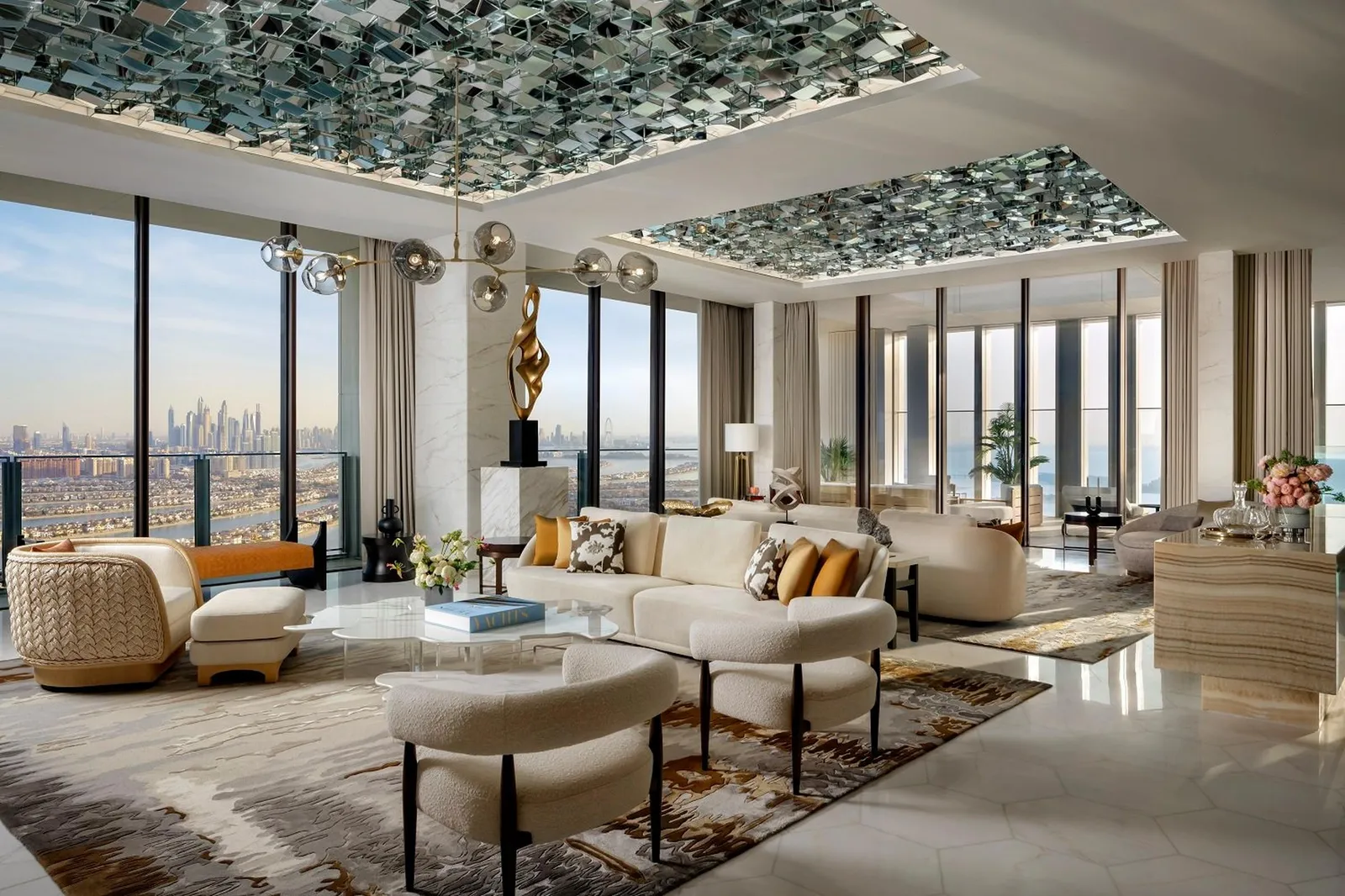 The Panoramic Penthouse living room with glass walls onto the Palm