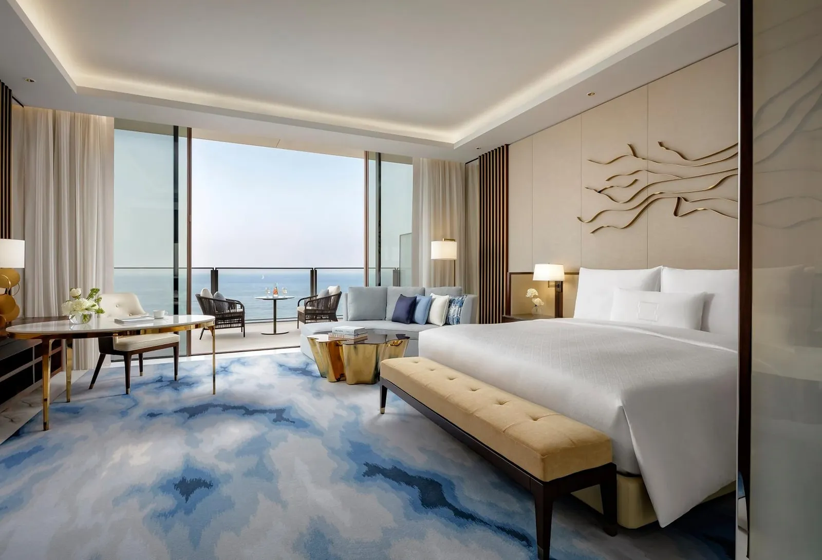 A king room with the sea beyond the glass