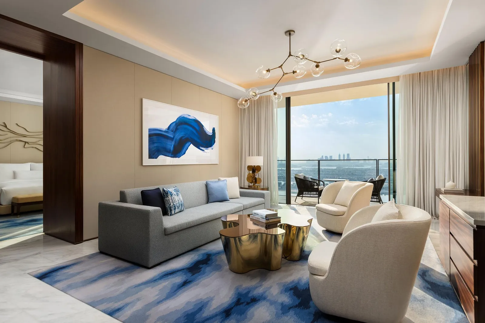 The living room of a 2-bedroom suite facing the Palm