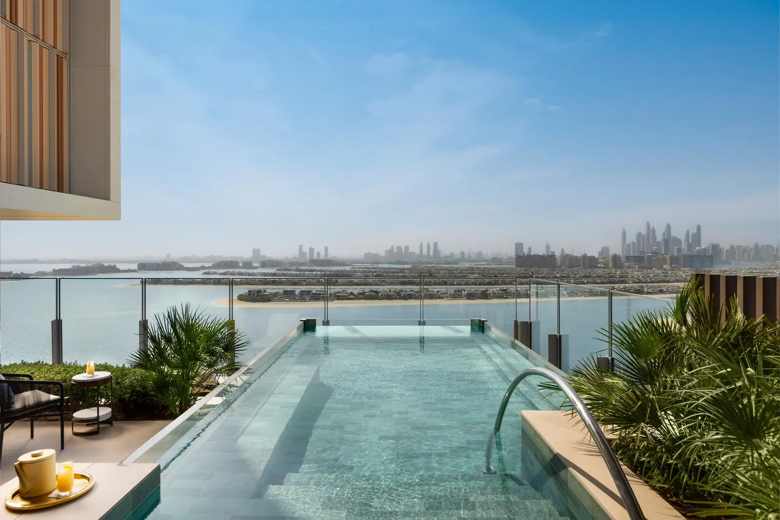 A private infinity pool with Dubai Marina behind it