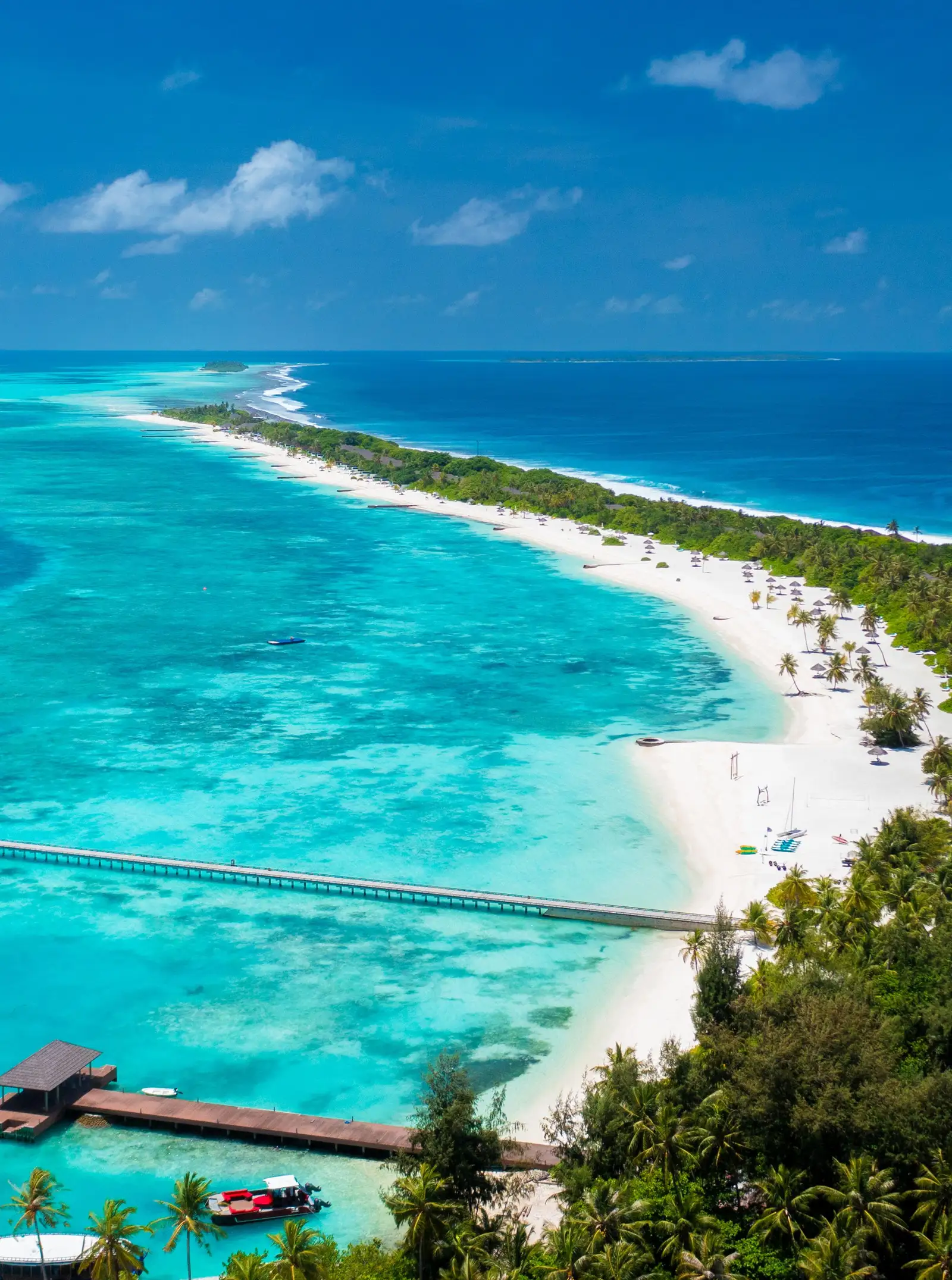 Kanifushi’s lagoon from the air, the long white beach and the jetty