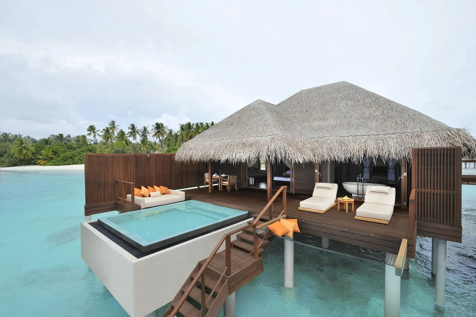 An Ocean Villa over the water: the pool on its deck and the ladder into the lagoon