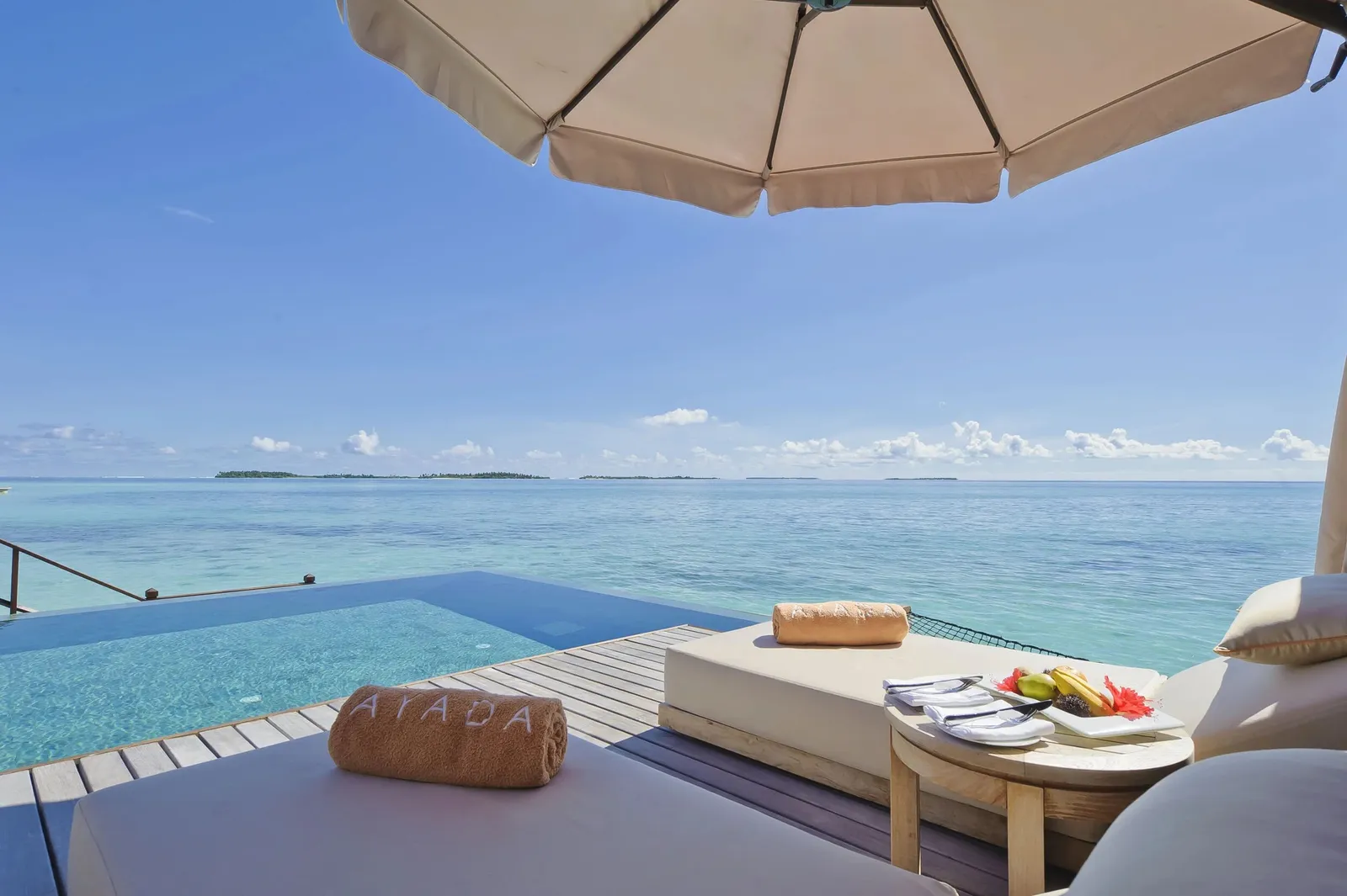 The edge of a Sunset Family Lagoon Suite’s pool and the open sea