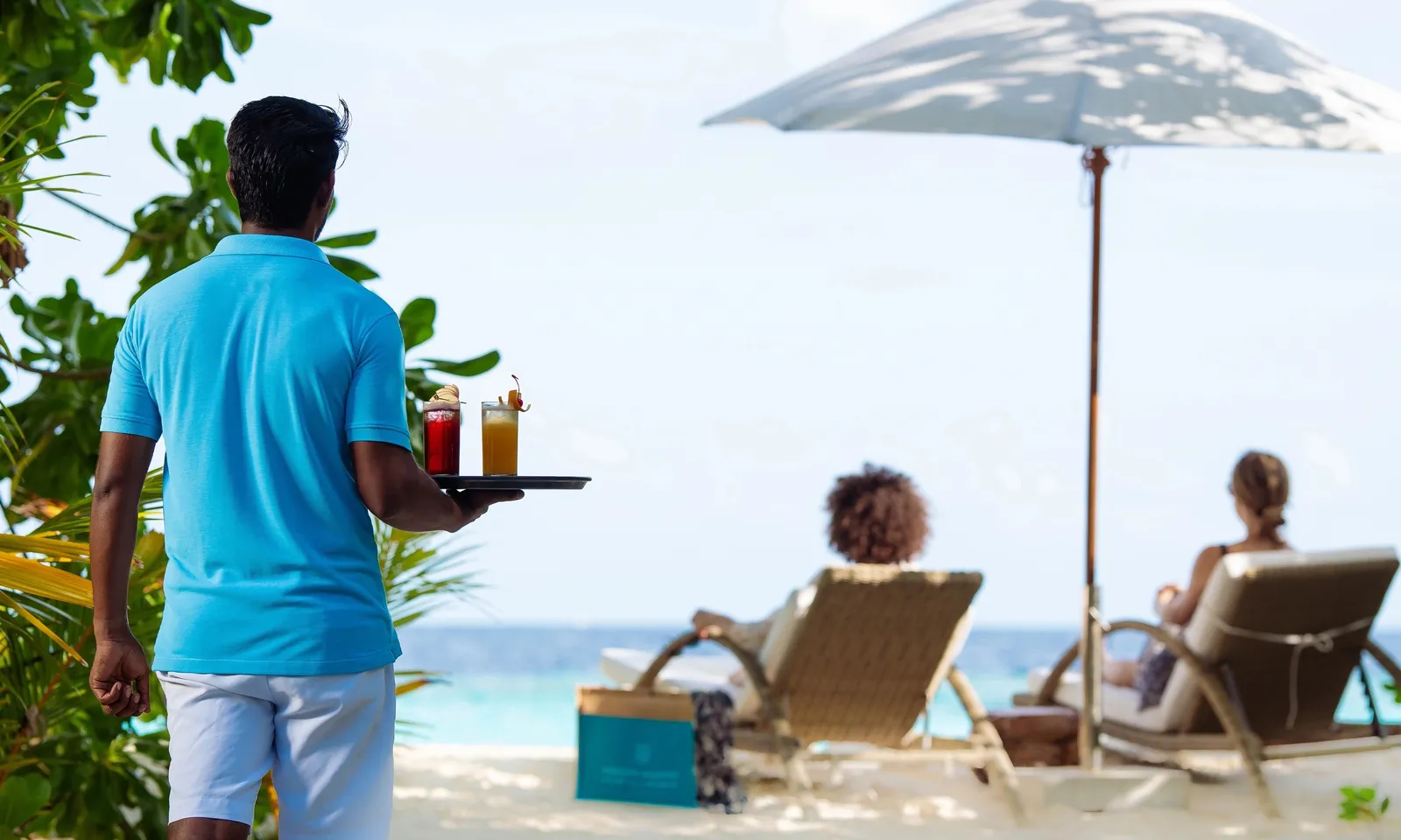 Drink service beside loungers on the beach