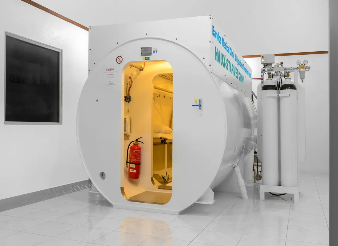 The clinic’s decompression chamber, its hatch open
