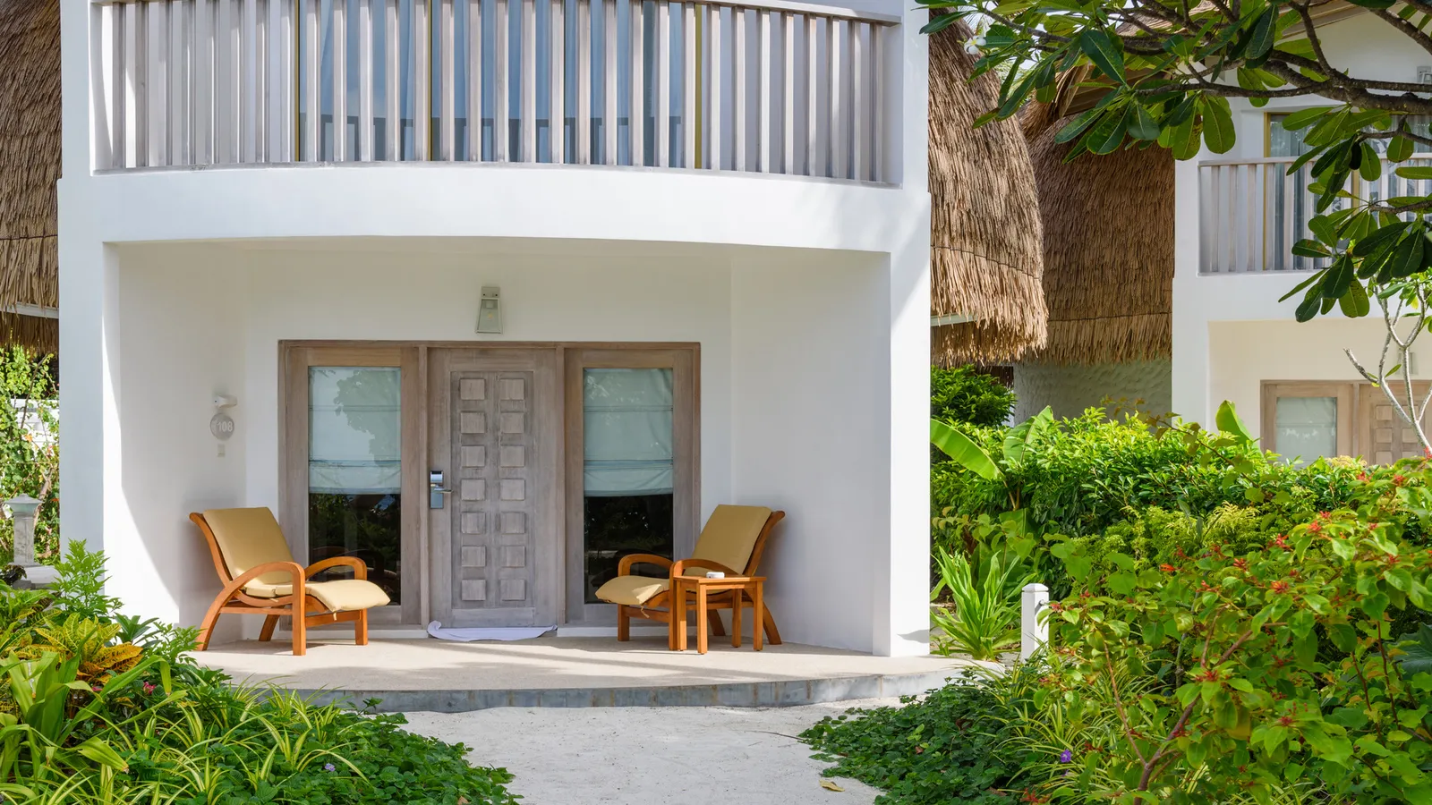The entrance of a 2-storey Premium Beach Villa, the balcony upstairs