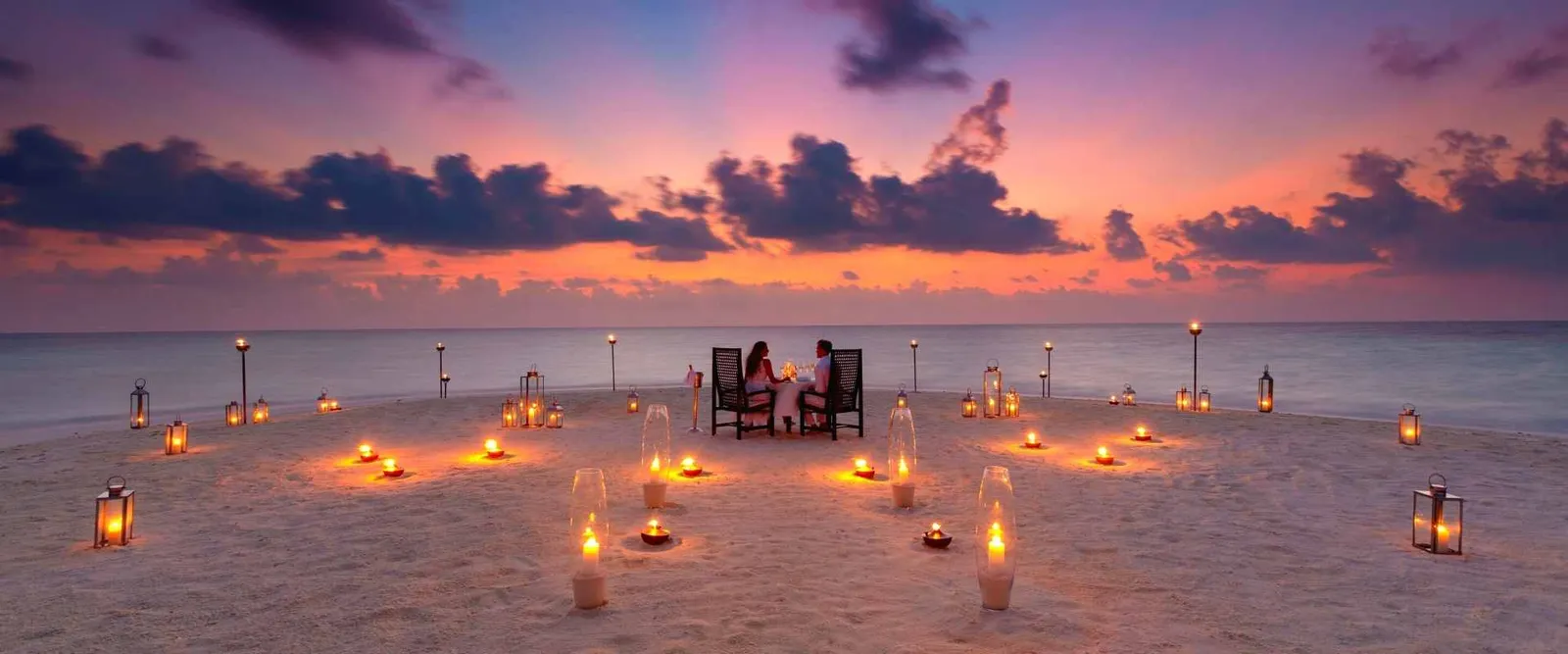 A candlelit dinner on the sandbank at sunset