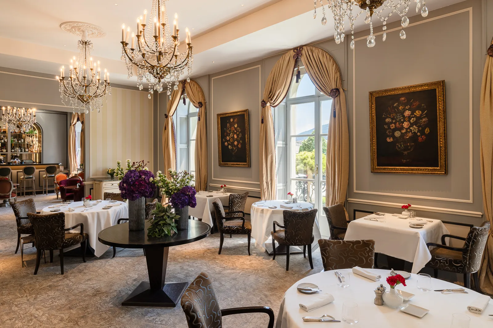 The Rivage Café dining room, with its chandeliers and laid tables
