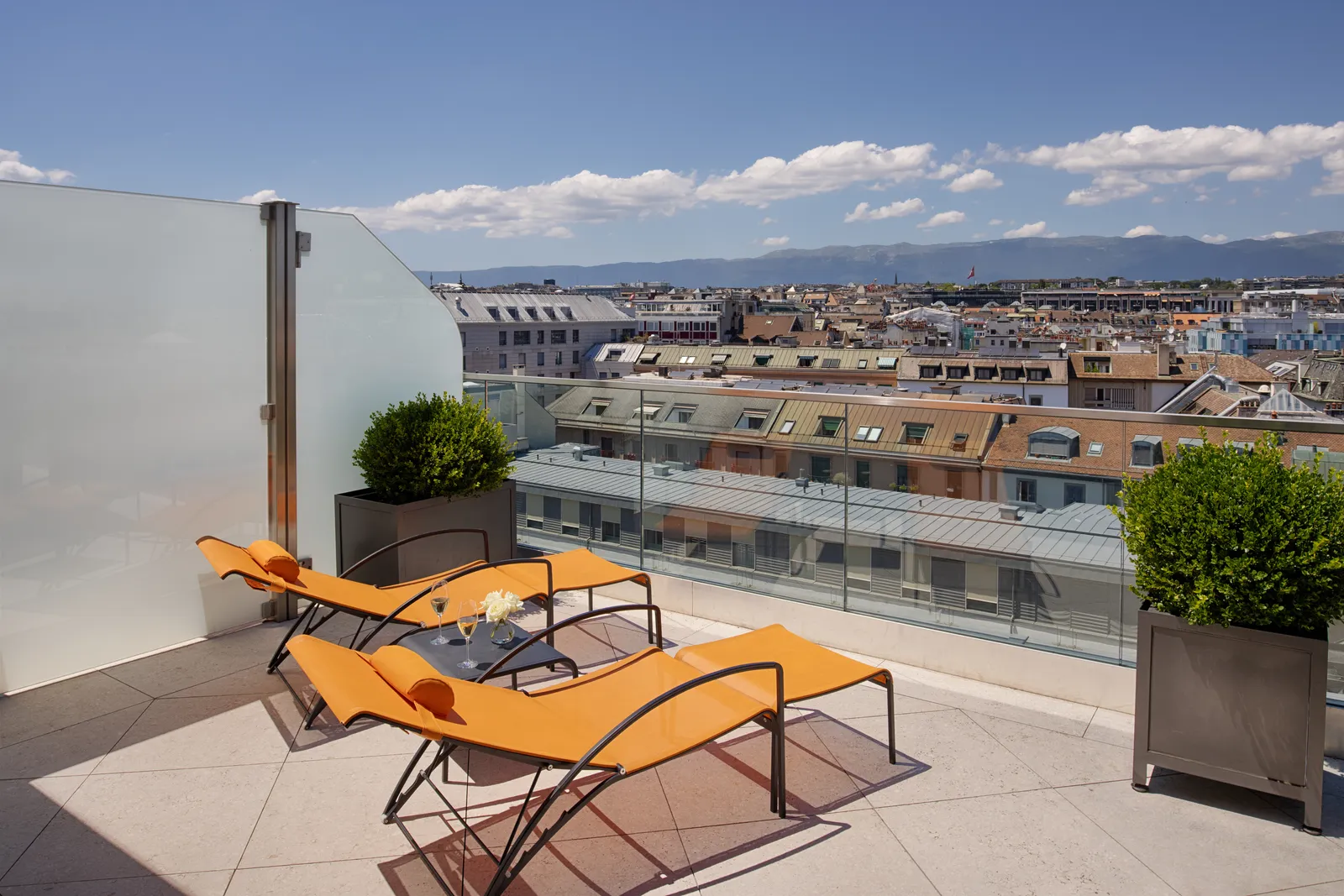 The Rooftop Junior Suite terrace, above the city roofs